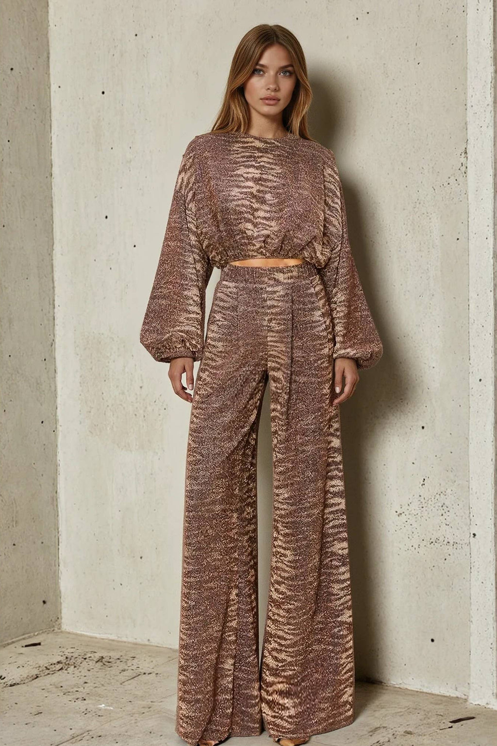 Woman wearing a bronze sequin outfit against a textured wall.