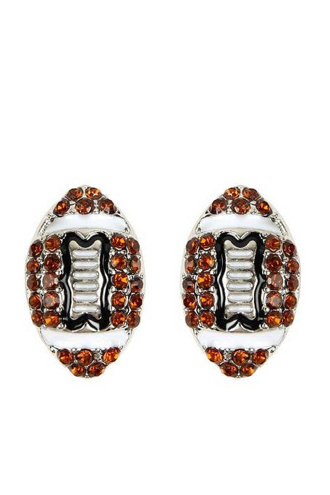 A pair of football-shaped stud earrings with a silver-tone base, black enamel detailing, and rows of round brown rhinestones on a plain white background.